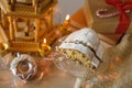 holiday composition with German Christmas cake stollen, Festive Decorations, garlands, lights, Christmas wooden carousel with Royalty Free Stock Photo