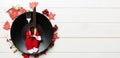 Holiday composition of plate and flatware decorated with Santa clothes on wooden background. Banner Top view of Christmas Royalty Free Stock Photo