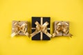 Holiday composition. Various gift boxes on pastel yellow background. Christmas, new year, birthday concept.