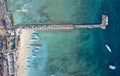 Holiday Concept Background. Top Down Drone Shot of Cars Entering Nusa Penida Island via Toya Pakeh Harbour. Bali - Indonesia