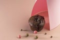 Holiday concept. Delicious homemade chocolate muffin with sweets on a pink background. Food geometric trend. Creative minimalist