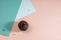 Holiday concept. Delicious homemade chocolate muffin with sweets on a pink and blue background. Geometric trend. Creative