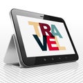 Holiday concept: Tablet Computer with Travel on display