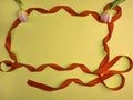 holiday curly tape and tulips on yellow background