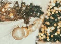 Holiday decorated room with Christmas tree and decoration, background with blurred, sparking, glowing light. Royalty Free Stock Photo
