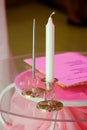 Holiday decoration decor. A candle in a candlestick on the table Royalty Free Stock Photo