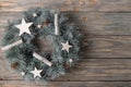 Festive decorations with Christmas wreath on wooden vintage background Royalty Free Stock Photo