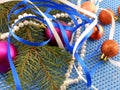 Holiday decorations: gifts, pearls, tree branch and christmas ball Royalty Free Stock Photo