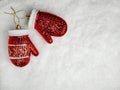 Holiday decorations. Glass Christmas tree toy red mittens in the snow. The concept of Christmas with copy space Royalty Free Stock Photo