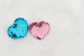 Holiday decorations to st. Valentine day. Two glowing hearts laying in winter snow. Copy space for text Royalty Free Stock Photo