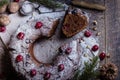 Holiday dessert. Traditional homemade christmas chocolate cake with cherry on wooden table Royalty Free Stock Photo
