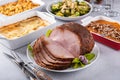 Holiday dinner with honey glazed spiral cut ham and all the sides Royalty Free Stock Photo