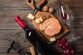 Holiday Dinner setting with red wine and creaming cheese on rustic wood. Top view with space for your greetings Royalty Free Stock Photo