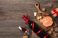 Holiday Dinner setting with red wine and creaming cheese on rustic wood. Top view with space for your greetings Royalty Free Stock Photo