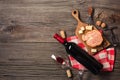 Holiday Dinner setting with red wine and creaming cheese on rustic wood. Top view with space for your greetings Royalty Free Stock Photo