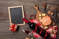 Holiday Dinner setting with red wine and creaming cheese on rustic wood. Top view with space for your greetings Royalty Free Stock Photo