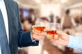 Holiday Event business people cheering each other with Whiskey Royalty Free Stock Photo