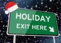 Holiday exit here on signpost or billboard against starry sky at christmas or xmas night. Concept Image Royalty Free Stock Photo