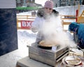 Holiday farewell to winter. Cooking pancakes on the street at Shrovetide