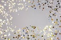 Holiday Festive background. gold and silver star confetti glitter scattered on grey background. Royalty Free Stock Photo