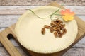 Holiday festive baking with an empty pie shell pastry crust with raw pecan nuts