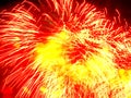 Holiday firework, red and yellow splashes Royalty Free Stock Photo