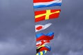 Holiday flags on a rope hanging, fluttering in the wind against the blue sky, holiday. Royalty Free Stock Photo