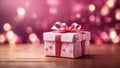 Pink gift box on holiday bokeh background