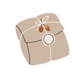 Holiday gift in rustic wrapping. Craft present, festive surprise wrapped in soft kraft paper, decorated with twine Royalty Free Stock Photo