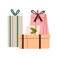 Holiday gifts, present boxes and bags composition. Festive surprises wrapped in paper wrapping, decorated with ribbons Royalty Free Stock Photo