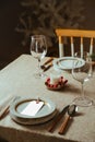 Holiday Gold place setting,  Christmas table with ornaments and natural pine branch on the livingroom home Royalty Free Stock Photo