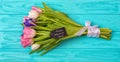 Spring background!A bouquet of tulips on a wooden background.Holiday greeting card for Valentine`s Day, Woman`s Day, Mother`s Day, Royalty Free Stock Photo