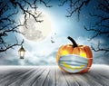 Holiday Halloween background with pumpkin wearing medical face mask. Halloween facial mask as a symbol for disease control Royalty Free Stock Photo