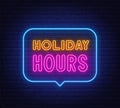 Holiday Hours neon sign in the speech bubble on brick wall background. Royalty Free Stock Photo