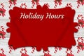 Holiday Hours sign with candy canes