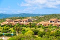 Holiday houses on green hillsTypical Corsican villa houses on green hill in rural landscape of Corsica island, France