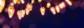 Holiday illumination and sparklers - christmas garland bokeh lights over blue background Royalty Free Stock Photo