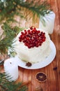 Holiday layered cake with cream and cranberry decoration