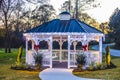 Holiday lighted Gazebo at golden hour empty