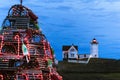 Holiday Lighthouse with Wooden Lobster Trap Tree in Foeground in Maine