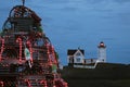 Holiday Lighthouse with Wooden Lobster Trap Tree in Foeground in