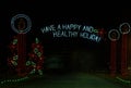 holiday lights at night spelling out have a happy and healthy holiday