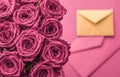 Holiday love letter and flowers delivery, luxury bouquet of roses and card on blush pink background for romantic holiday design Royalty Free Stock Photo