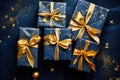 Holiday luxury gift boxes with golden bow ribbons and decor on blue background.Christmas gift wrapping Royalty Free Stock Photo