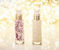 Holiday make-up base gel, serum emulsion, lotion bottle and golden glitter, luxury skin and body care cosmetics for beauty brand Royalty Free Stock Photo