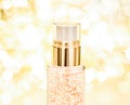 Holiday make-up base gel, serum emulsion, lotion bottle and golden glitter, luxury skin and body care cosmetics for beauty brand Royalty Free Stock Photo