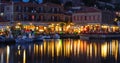 Holiday makers dining in harbor side restaurants Molyvos Greece Royalty Free Stock Photo