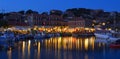 Holiday makers dining in harbor side restaurants Molyvos Greece