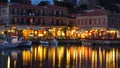 Holiday makers dining in harbor side restaurants Molyvos Greece