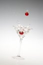 A Holiday martini with a falling red bauble.
